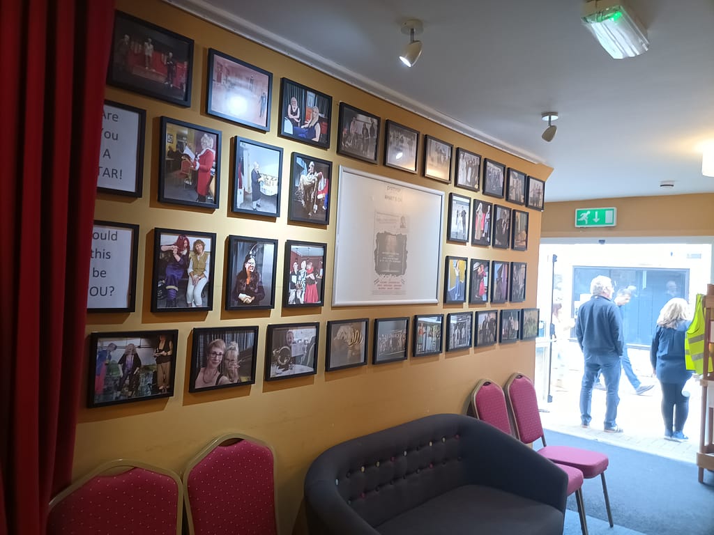 Inside the Prim-Raf theatre, showing the past shows on the wall, Cads entrance at Callington Prim-Raf