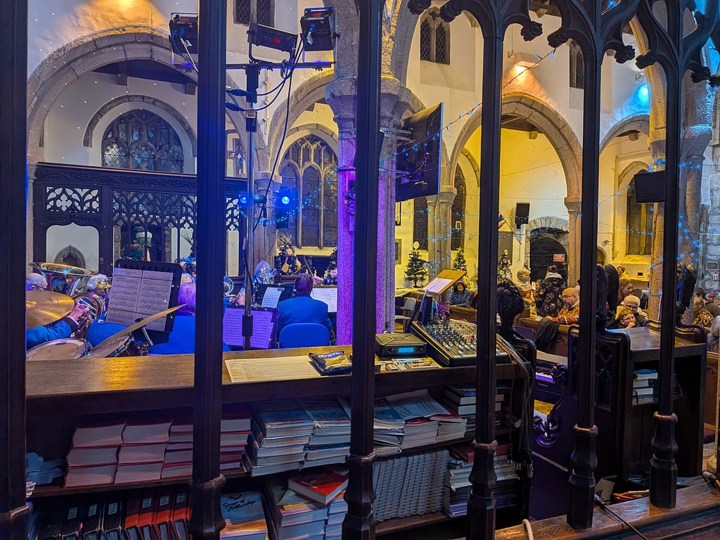 2025 tree festival inside Callington's St. Mary's church. Stage lighting 